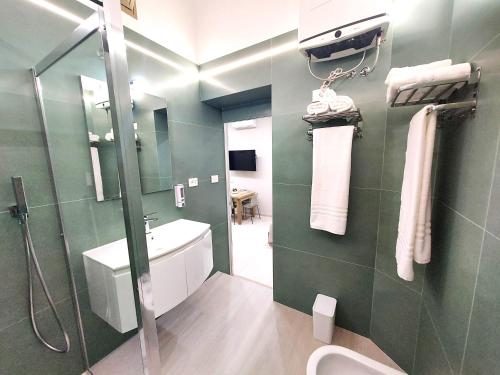 a bathroom with a shower and a sink at Dimora Tulliano in Manfredonia