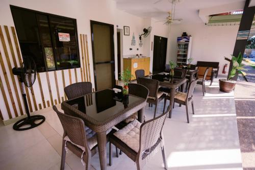 a group of tables and chairs in a restaurant at Selectum Mangrove Resort in Panglao