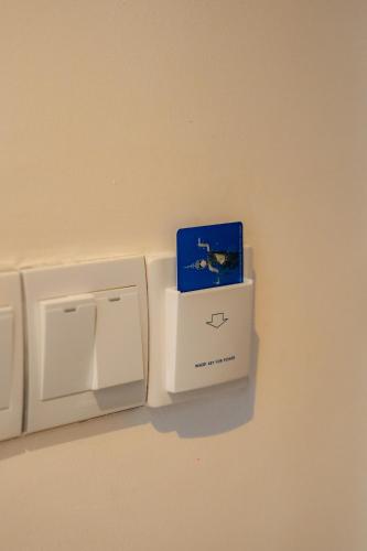 a box is sitting on top of a electrical outlet at The Scenic Hotel in Phnom Penh