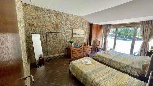 Ένα ή περισσότερα κρεβάτια σε δωμάτιο στο Quinta dos Amores