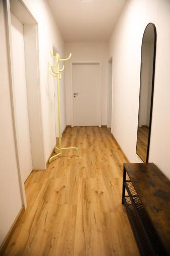 an empty hallway with a cross on the wall at Suite 13 Van Gogh in Neunburg vorm Wald