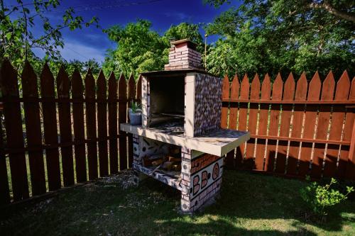 a brick oven sitting in front of a fence at Selectum Mangrove Resort in Panglao