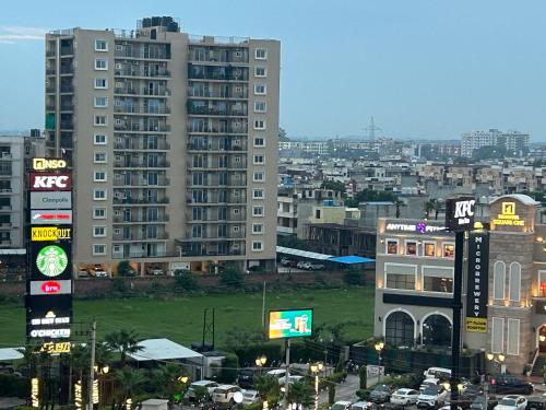 a city skyline with tall buildings and cars at Nivaasa Luxe in Kharar