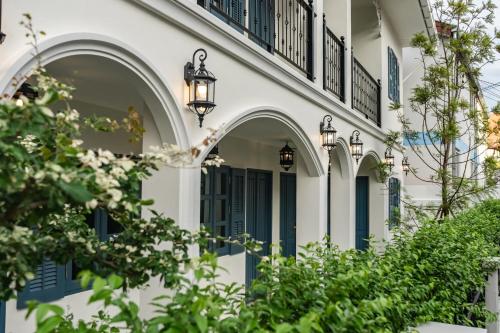 an exterior of a house with arches and lights at Le Wiang in Chiang Mai