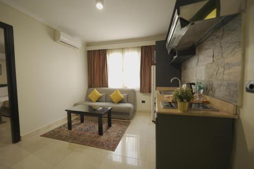 a living room with a couch and a table at NewCity Hotel & Suites in Cairo