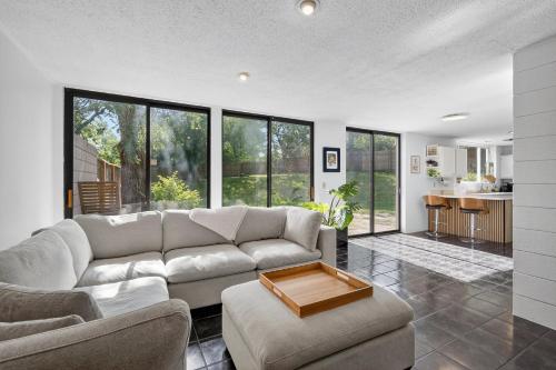 a living room with a couch and a table at The Palms Mirage House home in Millman