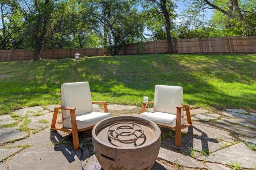 two chairs and a fire pit in a yard at The Palms Mirage House home in Millman