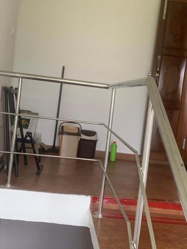 a metal bed frame in a room at Ruby in Kottayam
