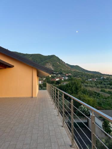 a balcony of a building with a mountain in the background at Villa Gjoni in Kalmet