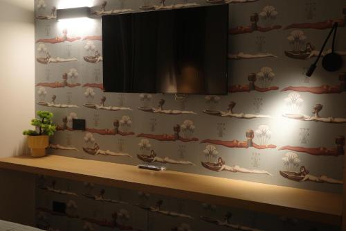 TV a/nebo společenská místnost v ubytování À la plage B