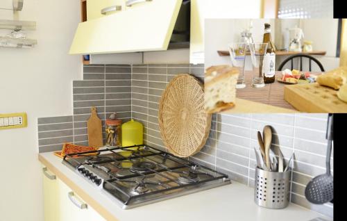 a kitchen counter with a stove and some bread at Casa Vacanza Viale Arbatax in Tortolì