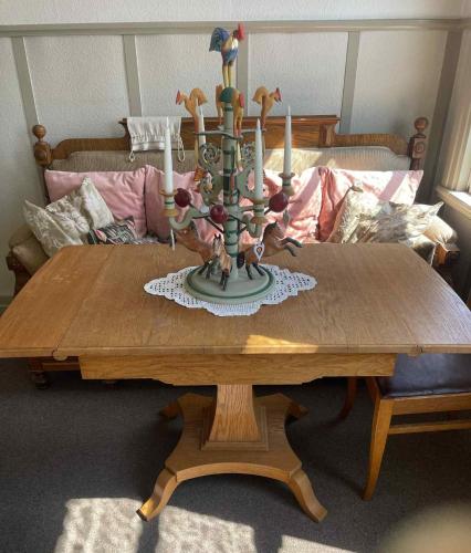 a wooden table with candles on top of it at Solsta Towers in Asarum