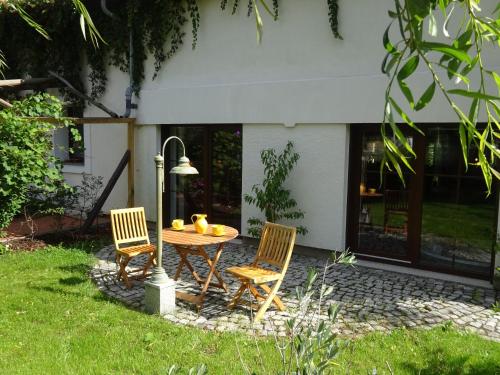 a table and two chairs and a table and chairs at Auszeit Posthausen in Machern