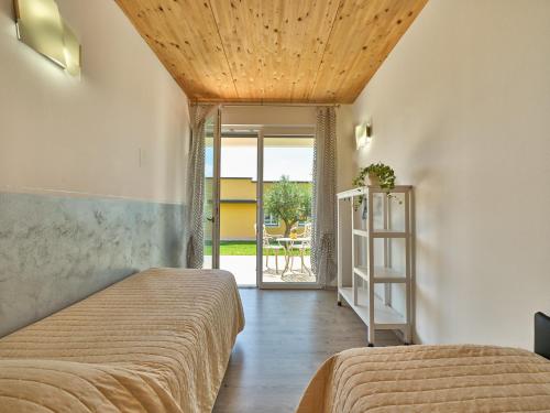 Ένα ή περισσότερα κρεβάτια σε δωμάτιο στο Agriturismo Monte Oliveto