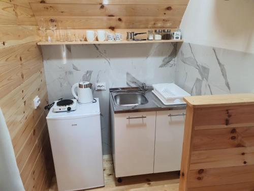 Kuchyň nebo kuchyňský kout v ubytování Village Cottage
