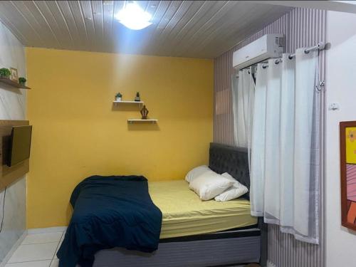 Ένα ή περισσότερα κρεβάτια σε δωμάτιο στο Alugo casa para COP 30