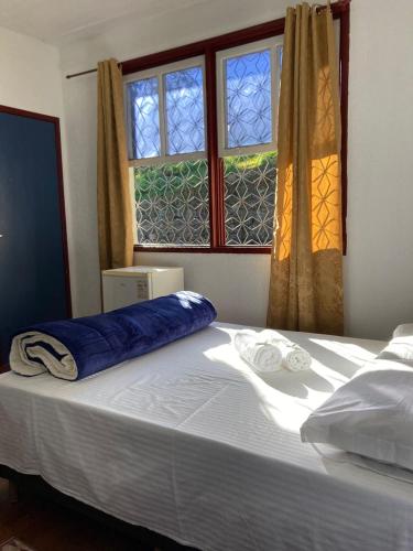 Postel nebo postele na pokoji v ubytování Pousada Solar das Gerais