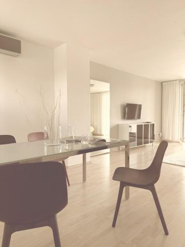 a dining room with a table and chairs at Villa Green in Sliač