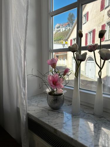 three vases with flowers on a window sill at NEU ... in 2 min. am Bodensee in Überlingen