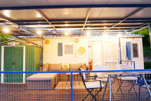a screened in porch with awning on a caravan at Seaside Garden Galaxidi in Galaxidhion