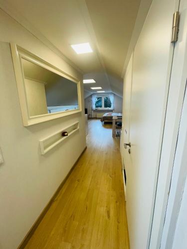a room with a hallway with a hallway at Klimatisierte Ferienwohnung in Seenähe in Zülpich