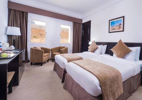 Ένα ή περισσότερα κρεβάτια σε δωμάτιο στο Best Western Sur