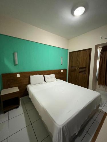 Postel nebo postele na pokoji v ubytování Joalpa Hotel