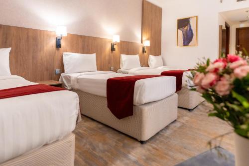 Ένα ή περισσότερα κρεβάτια σε δωμάτιο στο Hayah Golden Hotel