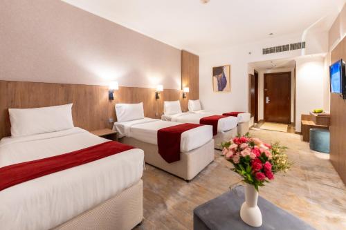 Ένα ή περισσότερα κρεβάτια σε δωμάτιο στο Hayah Golden Hotel