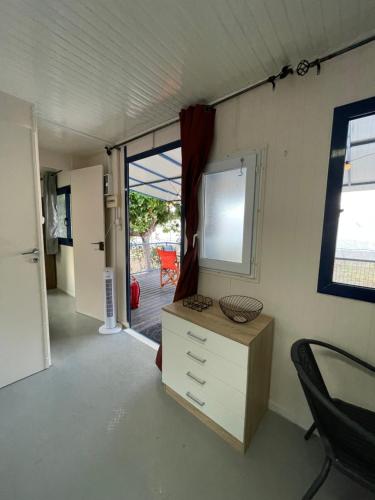 a room with a desk and a window and a chair at Seaside Garden Galaxidi in Galaxidhion