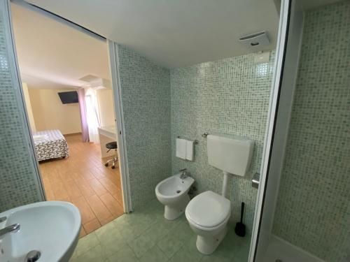 a bathroom with a toilet and a sink and a shower at Via Mameli 5 in Sanremo