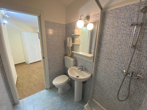 a bathroom with a toilet and a shower and a sink at Via Mameli 5 in Sanremo