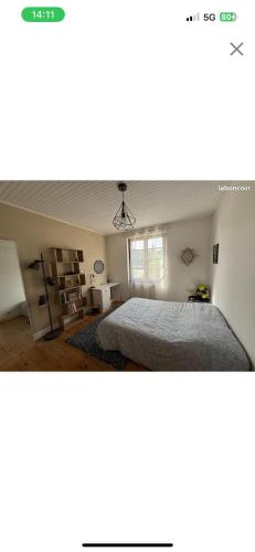 a bedroom with a bed and a window in it at Chez Maria & Franck in Desingy