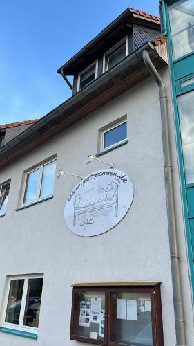 a sign on the side of a building at Pension Plesse-Blick Bovenden in Bovenden