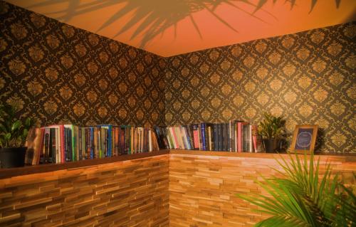 a book shelf filled with books in a room at Spacious vintage styled basement apartment - private in Calgary