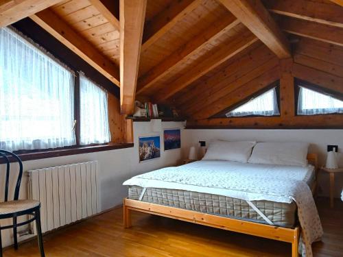 Postel nebo postele na pokoji v ubytování Casa Rosetta nel cuore delle Dolomiti