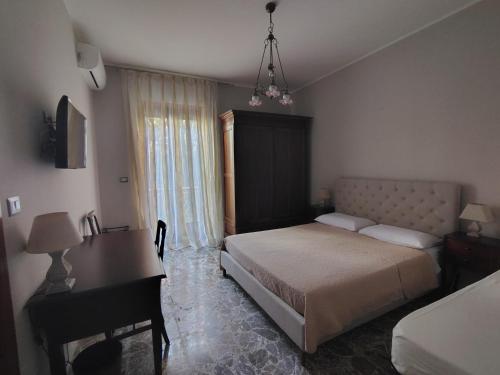 Ένα ή περισσότερα κρεβάτια σε δωμάτιο στο Nostos B&B - Back to the Sea