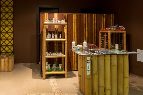 a room with two shelves with medicines on them at Bendita Mare Aparthotel in Golden Sands