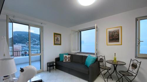 a living room with a couch and a table at CannetoMare in Canneto