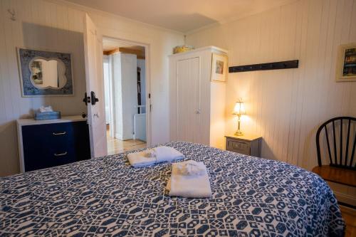 Ένα ή περισσότερα κρεβάτια σε δωμάτιο στο Auberge Évasion Nature Petite-Vallée