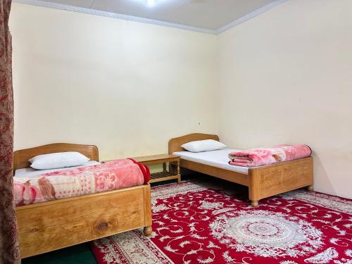 Кровать или кровати в номере Ayun Nest Guest House