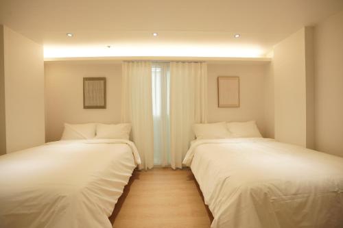 Katil atau katil-katil dalam bilik di Nomad Stay in Hongdae