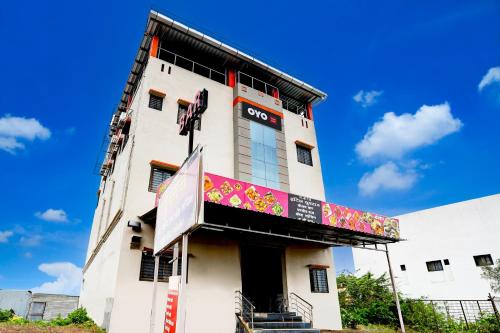 a building with a sign on the side of it at Hotel O Yuvraj Dhage Plot Shivshakti Maidan in Bārsi