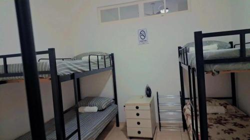 Ein Bett oder Betten in einem Zimmer der Unterkunft Casa Vila Santa Cecília - No Centro da Cidade