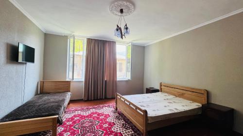 Ένα ή περισσότερα κρεβάτια σε δωμάτιο στο Likani House 1