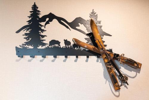 a pen with a bear and trees on a wall at Ośrodek Wypoczynkowy Bernadetta in Murzasichle