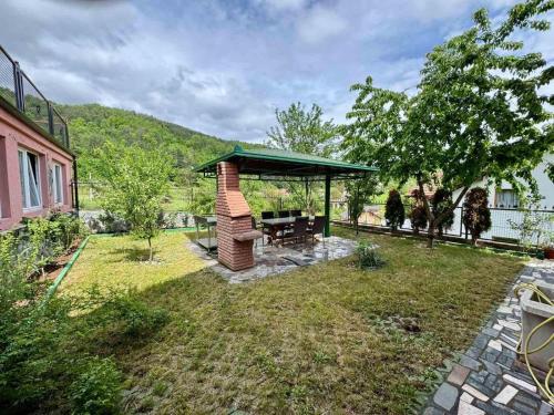 a gazebo in the backyard of a house at Stari grad Kuca in Sarajevo