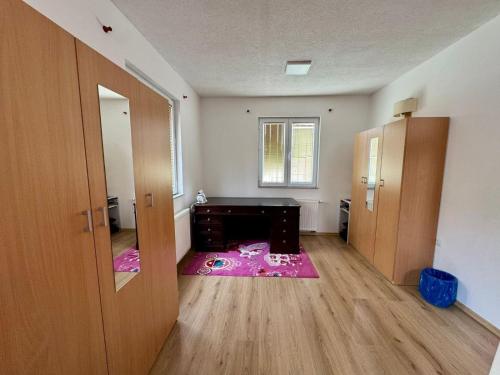 an empty room with a room with a fireplace in it at Stari grad Kuca in Sarajevo