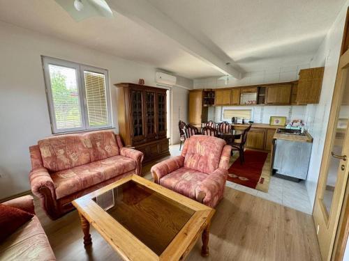 a living room with two couches and a table at Stari grad Kuca in Sarajevo