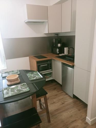 Cuina o zona de cuina de Studio cosy et équipé